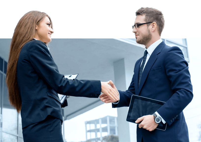 Man and woman dressed in suits shake hands